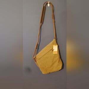 Tan Satchel with Adjustable Strap and Minimalist Design